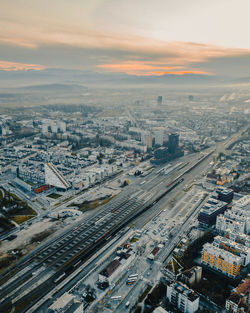 High angle view of buildings in city against sky during sunset