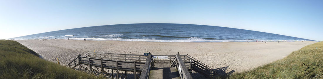 Panoramic view of sea against clear sky