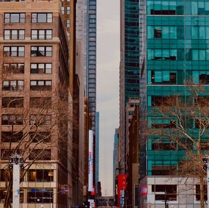 Buildings in city against sky