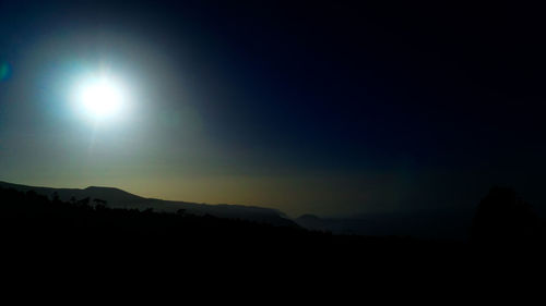 Silhouette landscape against sky