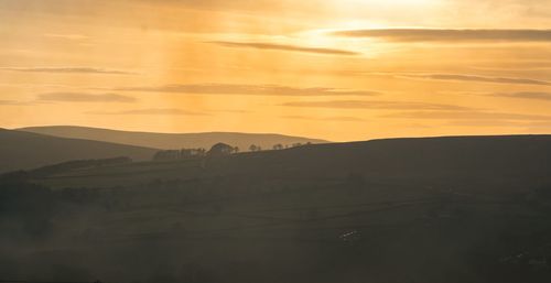 Scenic view of silhouette landscape against sky during sunset