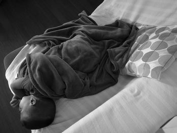 High angle view of boy sleeping