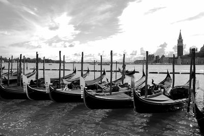 Boats moored in canal venice