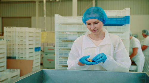 Portrait of young woman in laboratory