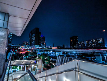 High angle view of illuminated buildings in city at night