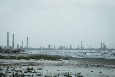 Panoramic view of city during winter against sky