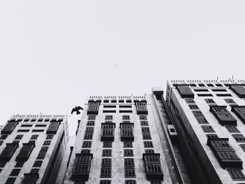 Low angle view of buildings against clear sky