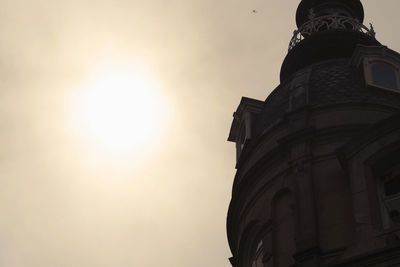 Low angle view of statue against sky at sunset