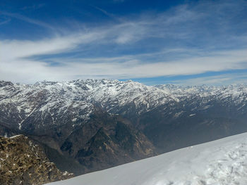 Scenic view of snowcapped mountains against sky