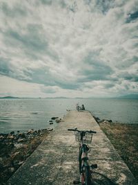 Scenic view of sea against cloudy sky