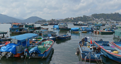 High angle view of boats moored in sea against sky