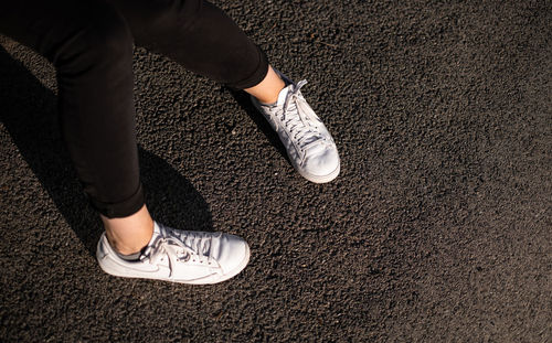 Low section of man standing on floor
