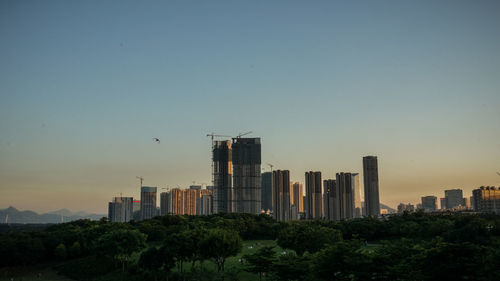 Modern buildings in city against sky