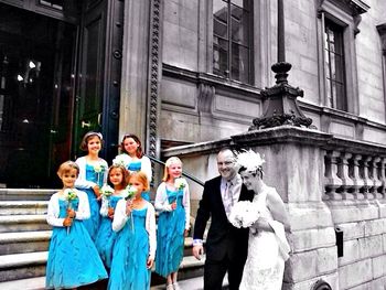 Woman standing by railing