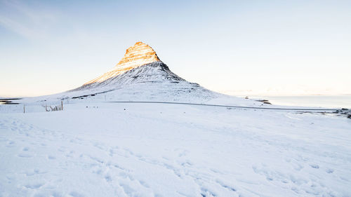 Scenic view of snowcapped mountain against sky