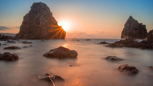 Scenic view of sea at sunset