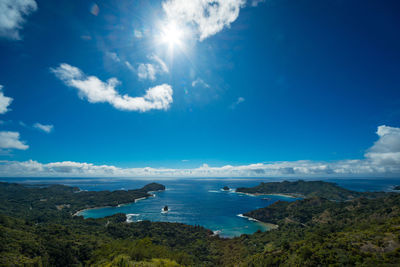 Panoramic view of sea against blue sky