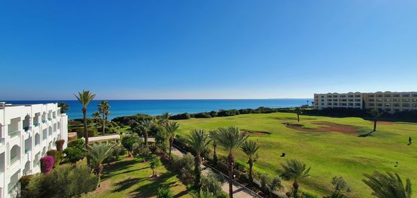 Scenic view of sea against clear blue sky