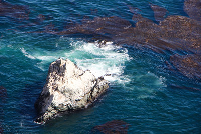 High angle view of rock formation in sea