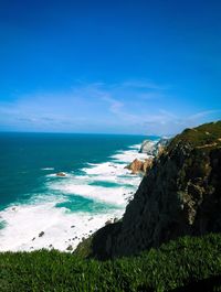 Scenic view of sea against blue sky