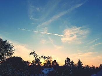 Low angle view of vapor trails in sky