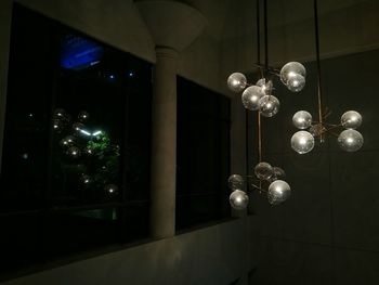 Illuminated lights hanging on ceiling at home