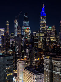 Illuminated buildings in city at night