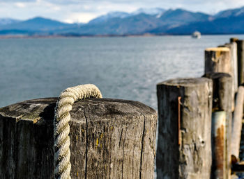 Close-up of wooden post in lake