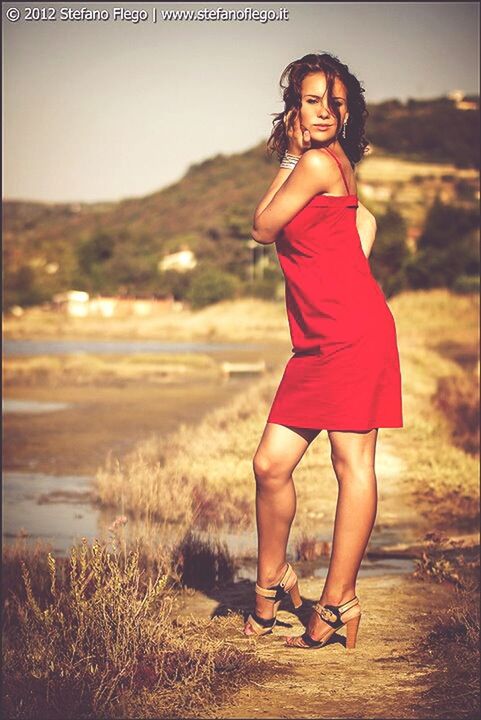 young adult, young women, lifestyles, leisure activity, person, full length, casual clothing, standing, beach, front view, looking at camera, water, dress, portrait, long hair, three quarter length, vacations