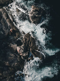 View of water flowing through rocks