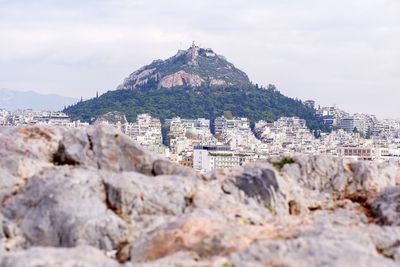 View of buildings in city against sky