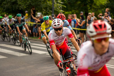 People riding bicycles on road