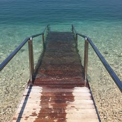 High angle view of stairs in water