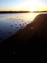 View of beach at sunset