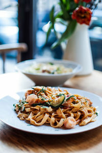 Close-up of pasta served in plate on table