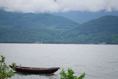 Scenic view of lake with mountains in background