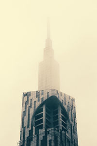 Low angle view of skyscraper against clear sky