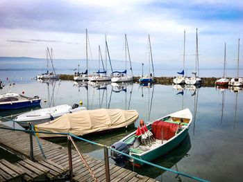 Boats moored at harbor