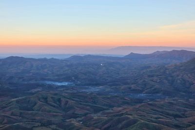 Scenic view of mountains against sky during sunset