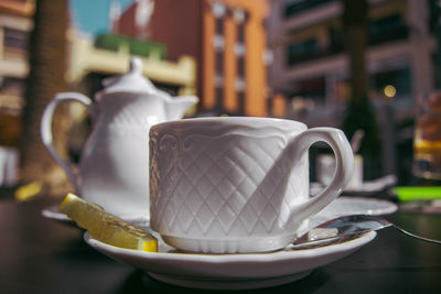 Close-up of coffee cup on table