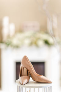 Close-up of shoes on table