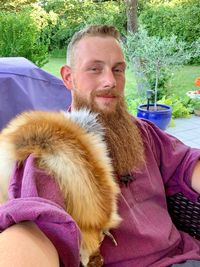 Portrait of smiling man sitting outdoors