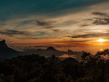 Scenic view of mountains against sky during sunset