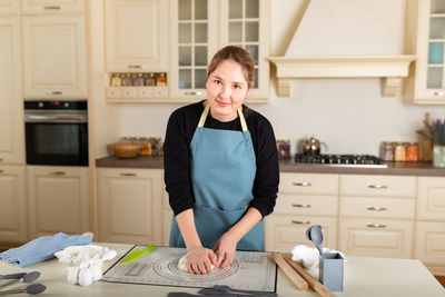 Portrait of young woman working at home