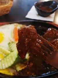 Close-up of meat on barbecue