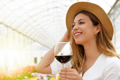 Smiling woman holding wineglass