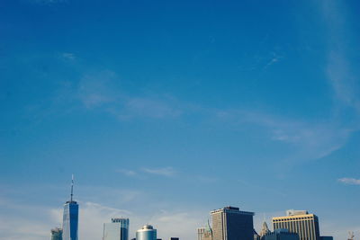 Low angle view of buildings against blue sky