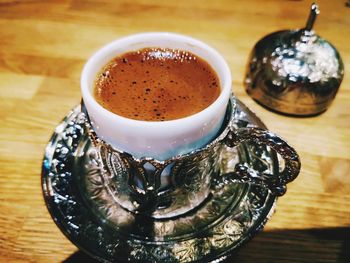 High angle view of coffee cup on table