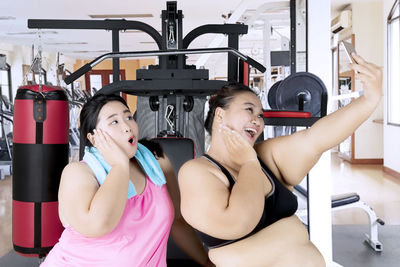 Female friends taking 8in gym