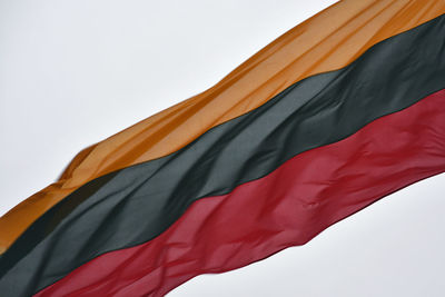 Low angle view of flag against clear sky